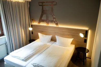 Ein Bett oder Betten in einem Zimmer der Unterkunft Hotel Haus Hohenstein