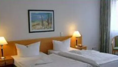 Ein Bett oder Betten in einem Zimmer der Unterkunft Hotel Specht