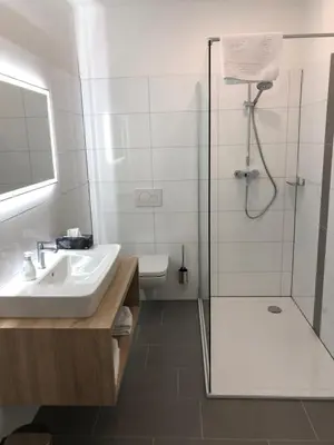 Ein Badezimmer in der Unterkunft Burbaums Restaurant Hotel