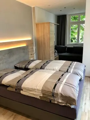 Ein Bett oder Betten in einem Zimmer der Unterkunft Burbaums Restaurant Hotel