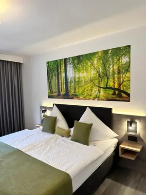 Ein Bett oder Betten in einem Zimmer der Unterkunft an Hotel GmbH
