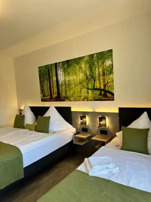 Ein Bett oder Betten in einem Zimmer der Unterkunft an Hotel GmbH