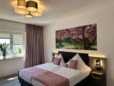 Ein Bett oder Betten in einem Zimmer der Unterkunft an Hotel GmbH