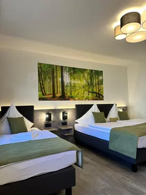 Ein Bett oder Betten in einem Zimmer der Unterkunft an Hotel GmbH