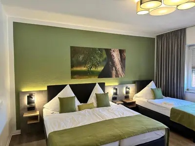 Ein Bett oder Betten in einem Zimmer der Unterkunft an Hotel GmbH
