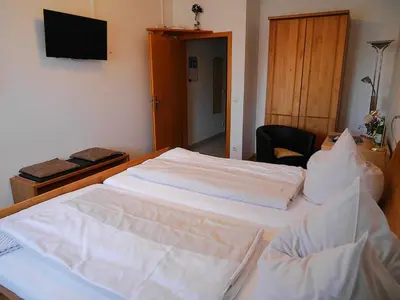 Ein Bett oder Betten in einem Zimmer der Unterkunft Gästezimmer Lammersmann