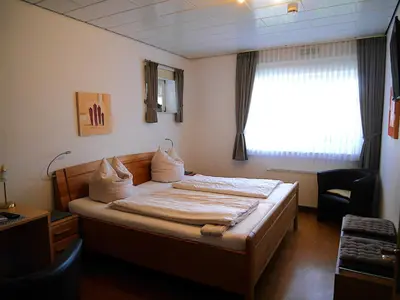 Ein Bett oder Betten in einem Zimmer der Unterkunft Gästezimmer Lammersmann