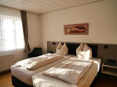 Ein Bett oder Betten in einem Zimmer der Unterkunft Gästezimmer Lammersmann