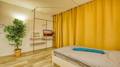 Ein Bett oder Betten in einem Zimmer der Unterkunft Unperfekthotel CoWorkingHotel