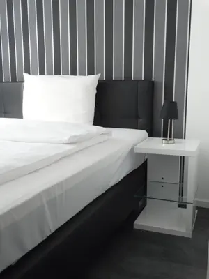Ein Bett oder Betten in einem Zimmer der Unterkunft Hotel Stay