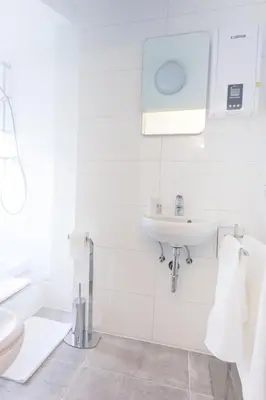 Ein Badezimmer in der Unterkunft TM Suites