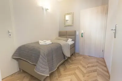 Ein Bett oder Betten in einem Zimmer der Unterkunft TM Suites