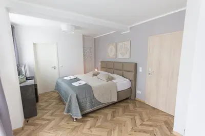 Ein Bett oder Betten in einem Zimmer der Unterkunft TM Suites