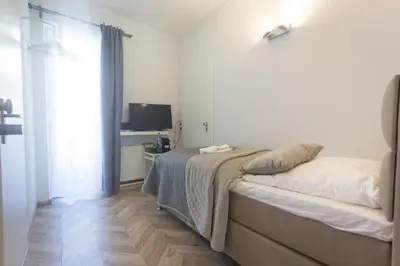 Ein Bett oder Betten in einem Zimmer der Unterkunft TM Suites