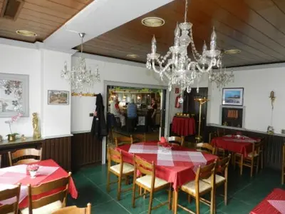 Ein Restaurant oder anderes Speiselokal in der Unterkunft Hotel In der Meile