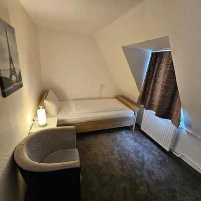 Ein Bett oder Betten in einem Zimmer der Unterkunft Hotel Kölner Hof