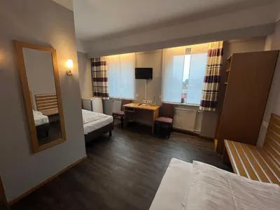 Ein Bett oder Betten in einem Zimmer der Unterkunft Hotel Wolfsjäger