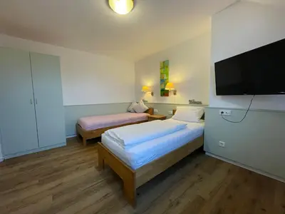 Ein Bett oder Betten in einem Zimmer der Unterkunft Hotel Wolfsjäger