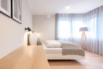 Ein Bett oder Betten in einem Zimmer der Unterkunft The Woodmans Airport Boardinghouse