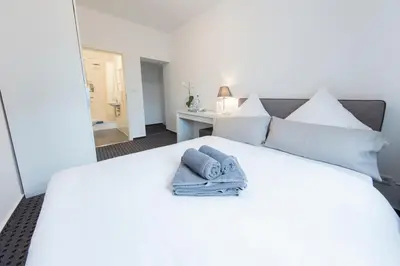 Ein Bett oder Betten in einem Zimmer der Unterkunft Berolina Haus