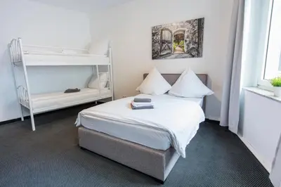 Ein Bett oder Betten in einem Zimmer der Unterkunft Berolina Haus
