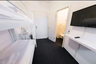 Ein Bett oder Betten in einem Zimmer der Unterkunft Berolina Haus