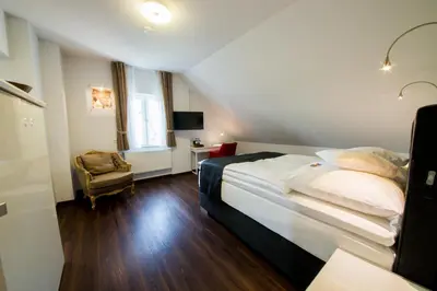 Ein Bett oder Betten in einem Zimmer der Unterkunft Landhotel Alte Töpferei