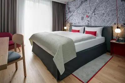 Ein Bett oder Betten in einem Zimmer der Unterkunft IntercityHotel Duisburg