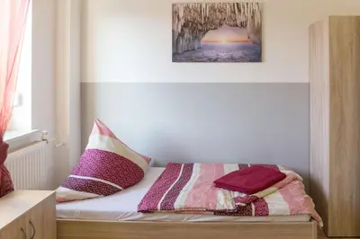 Ein Bett oder Betten in einem Zimmer der Unterkunft Ferienwohnung