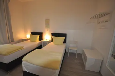 Ein Bett oder Betten in einem Zimmer der Unterkunft Apartment Dusseldorf-City