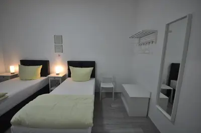Ein Bett oder Betten in einem Zimmer der Unterkunft Apartment Dusseldorf-City