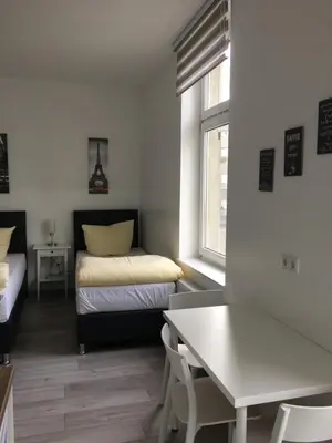 Ein Bett oder Betten in einem Zimmer der Unterkunft Apartment Dusseldorf-City