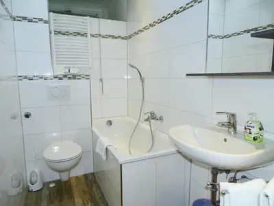 Ein Badezimmer in der Unterkunft AVI City Apartments GoodHouse