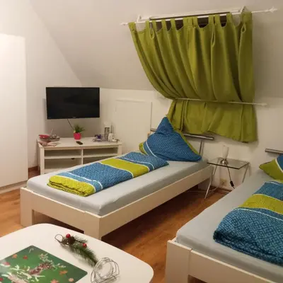 Ein Bett oder Betten in einem Zimmer der Unterkunft Gäste Monteurzimmer Haus Südstadt