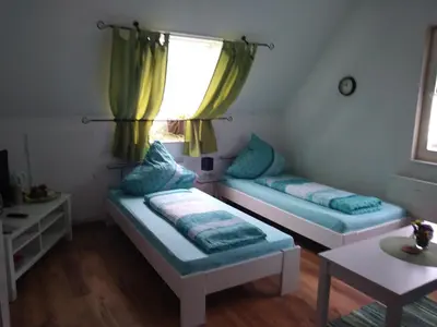Ein Bett oder Betten in einem Zimmer der Unterkunft Gäste Monteurzimmer Haus Südstadt