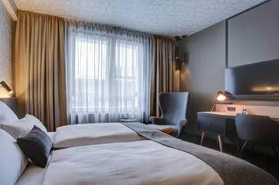 Ein Bett oder Betten in einem Zimmer der Unterkunft Vienna House Easy by Wyndham Dortmund City