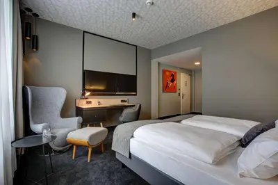 Ein Bett oder Betten in einem Zimmer der Unterkunft Vienna House Easy by Wyndham Dortmund City