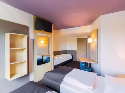 Ein Bett oder Betten in einem Zimmer der Unterkunft B&B Hotel Düsseldorf-Airport