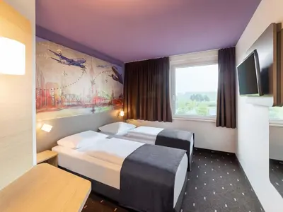 Ein Bett oder Betten in einem Zimmer der Unterkunft B&B Hotel Düsseldorf-Airport