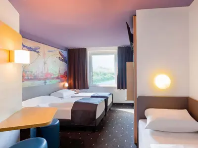 Ein Bett oder Betten in einem Zimmer der Unterkunft B&B Hotel Düsseldorf-Airport
