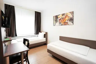 Ein Bett oder Betten in einem Zimmer der Unterkunft Hotel Frohnhauser Hof