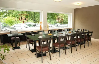 Ein Restaurant oder anderes Speiselokal in der Unterkunft Hotel Frohnhauser Hof