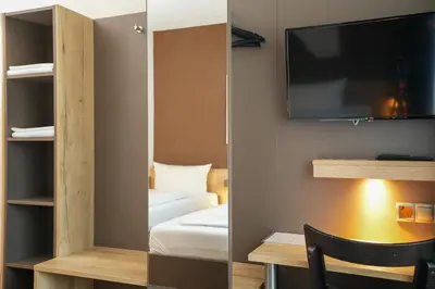 Ein Bett oder Betten in einem Zimmer der Unterkunft Hotel Frohnhauser Hof