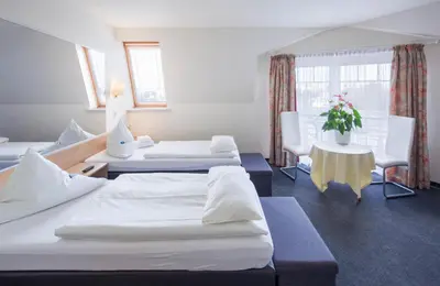 Ein Bett oder Betten in einem Zimmer der Unterkunft Hotel Moerser Hof