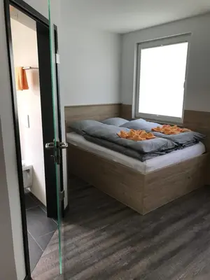 Ein Bett oder Betten in einem Zimmer der Unterkunft Kraftwerk Relax Motel