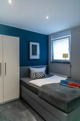 Ein Bett oder Betten in einem Zimmer der Unterkunft Aparthotel Menden
