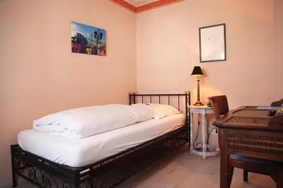 Ein Bett oder Betten in einem Zimmer der Unterkunft Hotel La Scala