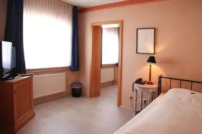Ein Bett oder Betten in einem Zimmer der Unterkunft Hotel La Scala