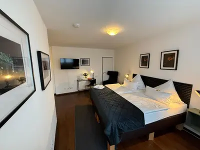 Ein Bett oder Betten in einem Zimmer der Unterkunft Hotel NeuHaus