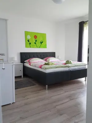 Ein Bett oder Betten in einem Zimmer der Unterkunft Gästehaus am Hattinger Rathaus
